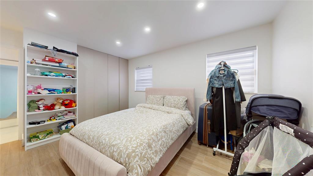 4060 Southwest 70th Terrace Davie, FL 33314 - Photo 16 of 22 a bedroom with a bed and a window