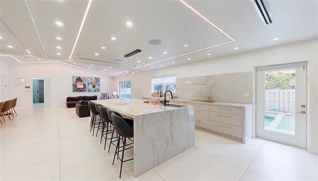 4060 Southwest 70th Terrace Davie, FL 33314 - Photo 19 of 22 a kitchen with a sink stainless steel appliances and cabinets