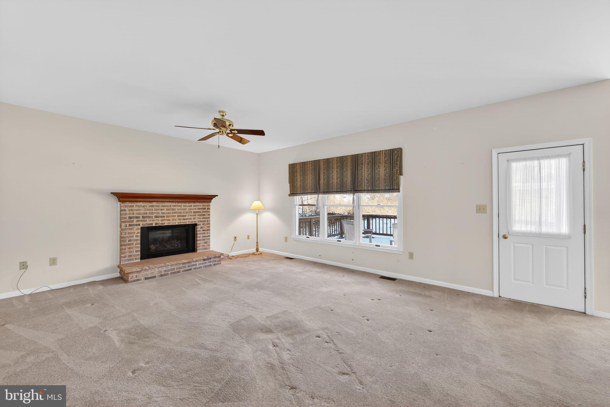 221 Cullen Way Newark, DE 19711 - Photo 13 of 37 a view of a livingroom with a fireplace and window