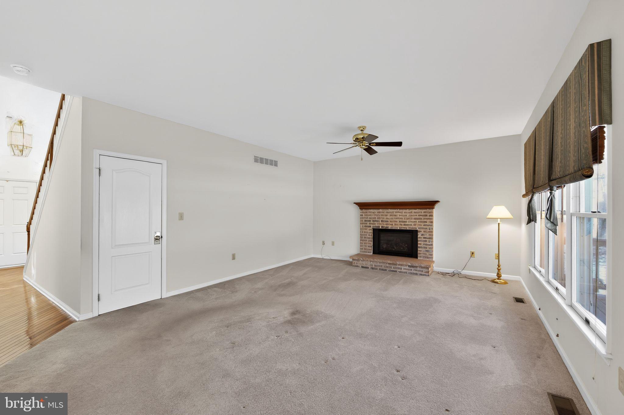 221 Cullen Way Newark, DE 19711 - Photo 15 of 37 a view of an empty room with a fireplace