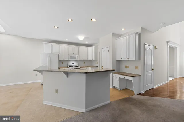 a kitchen with stainless steel appliances cabinets a sink and a counter top space
