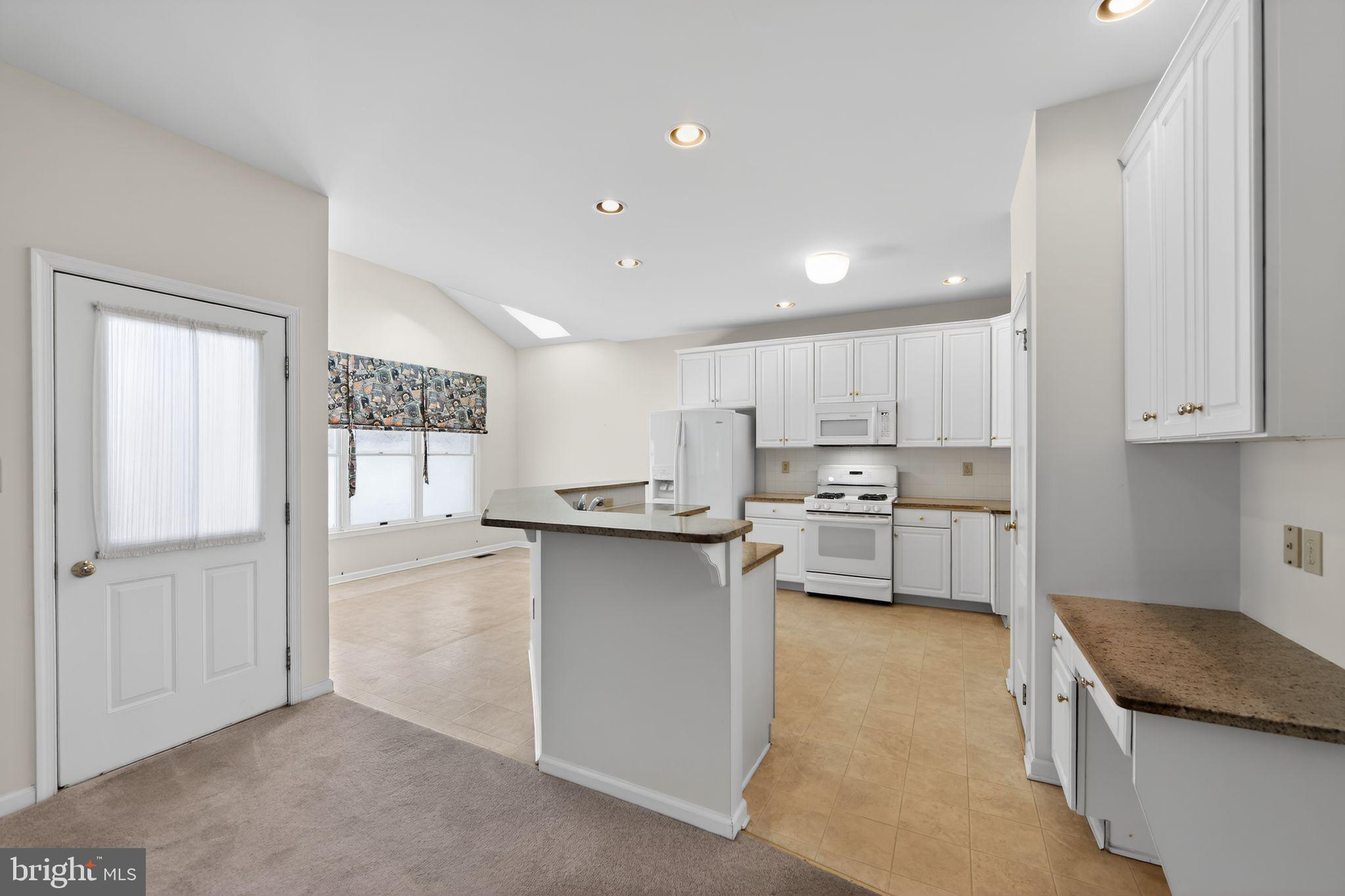 221 Cullen Way Newark, DE 19711 - Photo 19 of 37 a kitchen with white cabinets and sink