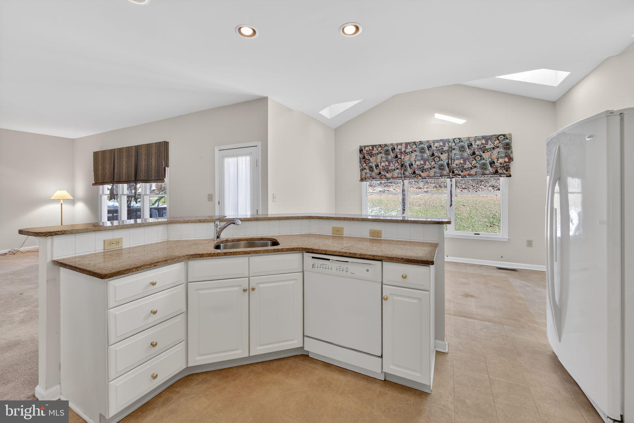 221 Cullen Way Newark, DE 19711 - Photo 20 of 37 a spacious bathroom with a granite countertop sink a toilet a mirror and shower
