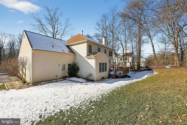 a view of a house with a snow in the yard