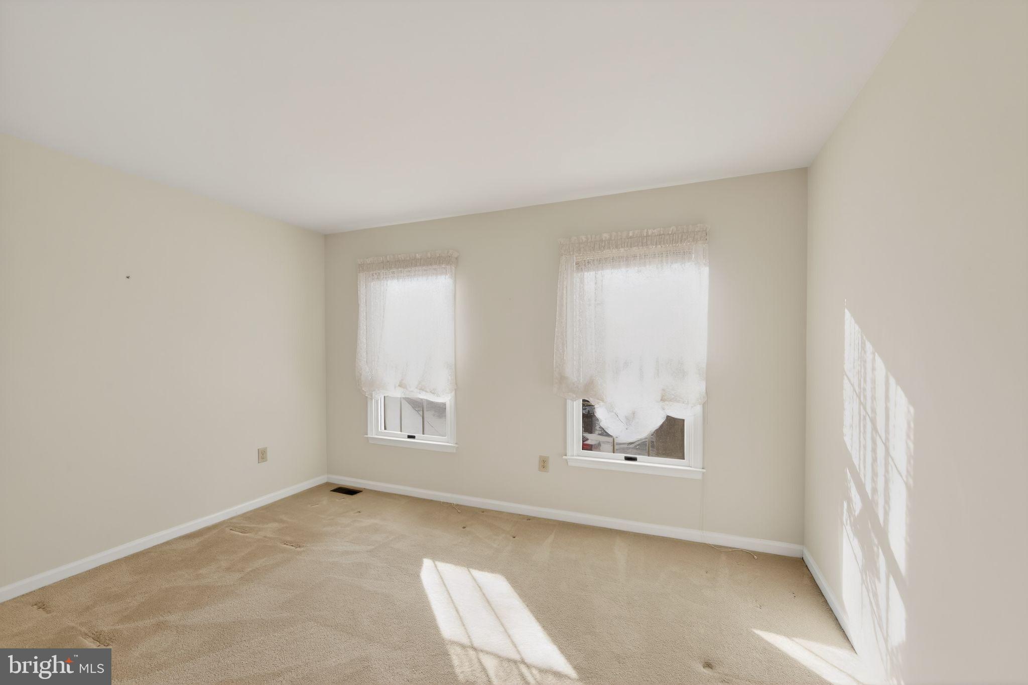 221 Cullen Way Newark, DE 19711 - Photo 6 of 37 an empty room with windows