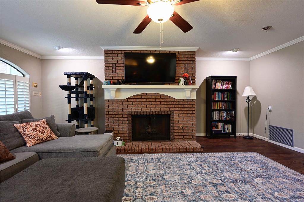 32 Rue Maison Abilene, TX 79605 - Photo 4 of 40 a living room with furniture and a fireplace