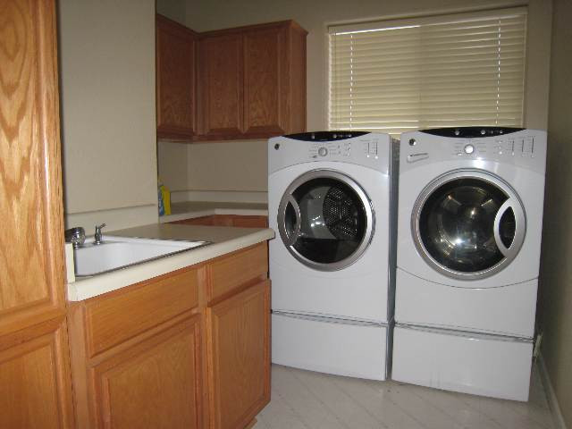 714 Gold Run Court Reno, NV 89521 - Photo 8 of 9 a utility room with dryer and washer