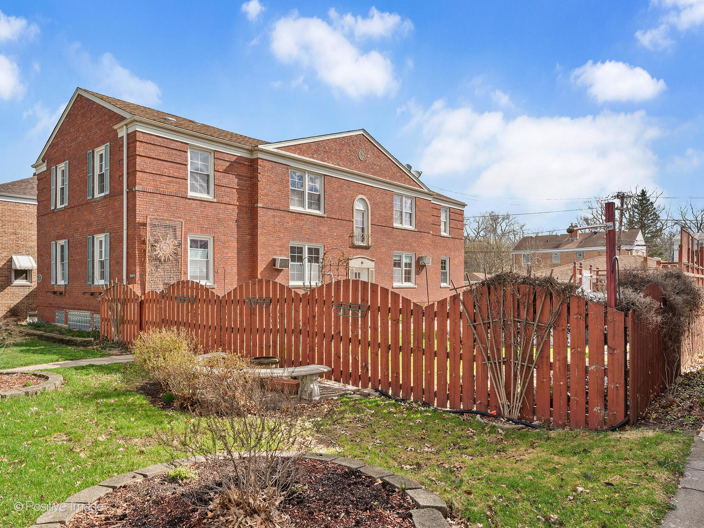 3505 Prairie Avenue, Unit 2W Brookfield, IL 60513 - Photo 1 of 11 a front view of a house with a garden