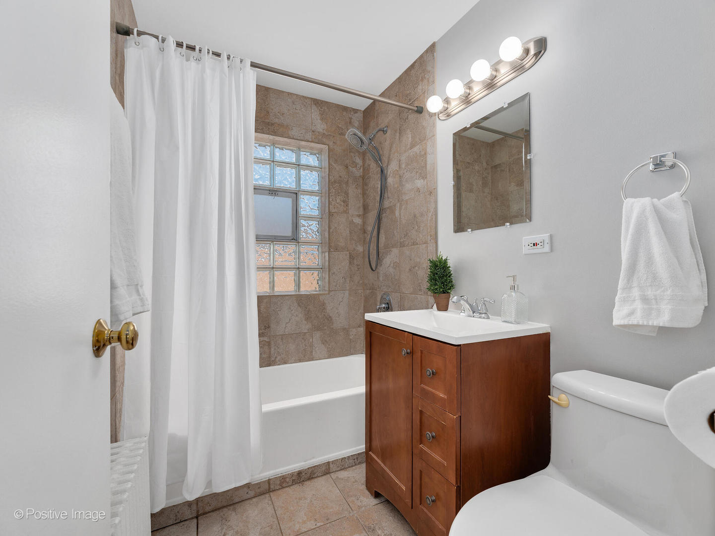 3505 Prairie Avenue, Unit 2W Brookfield, IL 60513 - Photo 11 of 11 a bathroom with a sink toilet and shower