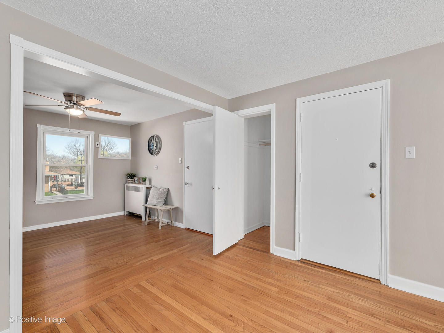 3505 Prairie Avenue, Unit 2W Brookfield, IL 60513 - Photo 5 of 11 a view of an empty room with wooden floor and a window