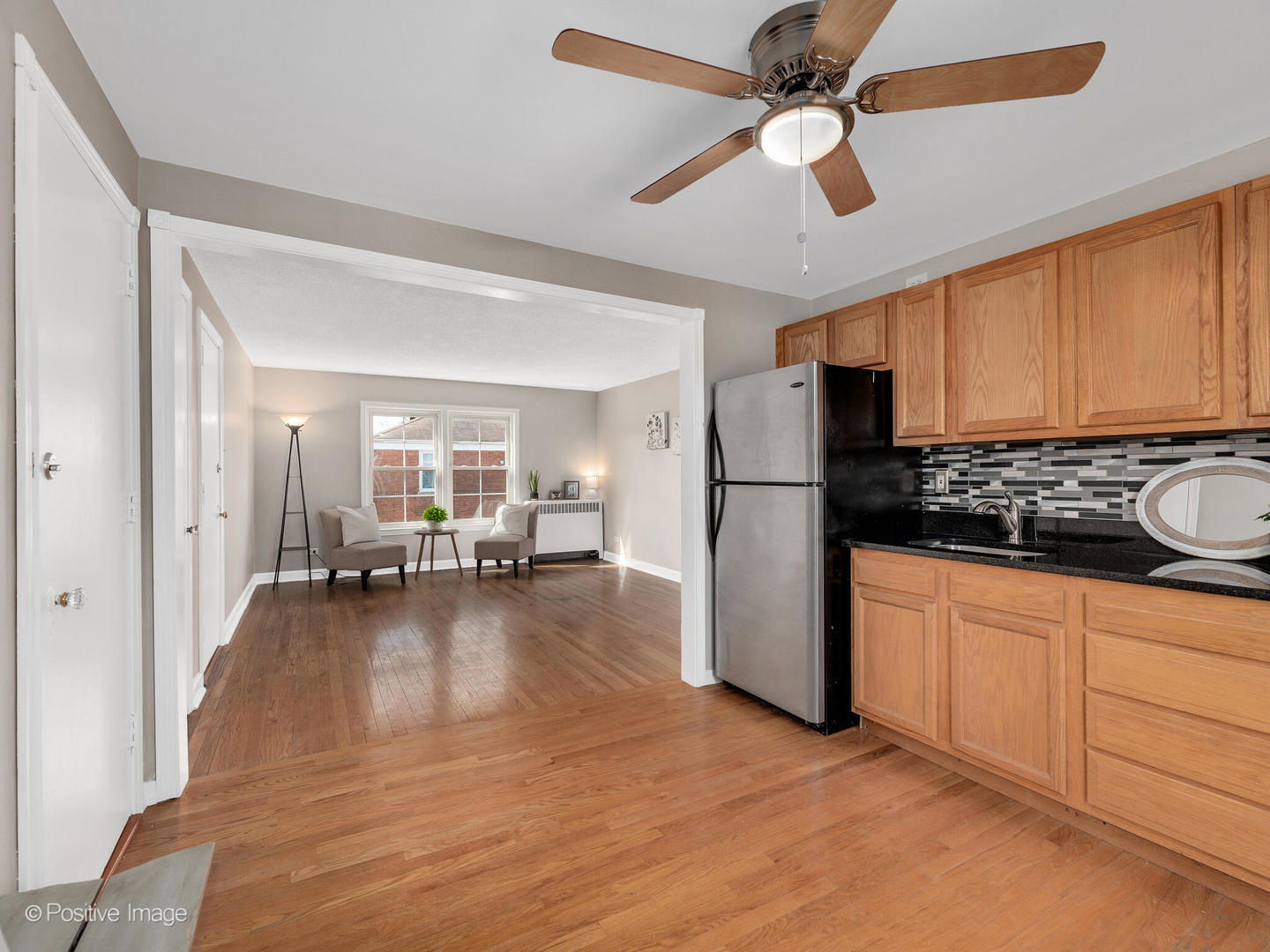 3505 Prairie Avenue, Unit 2W Brookfield, IL 60513 - Photo 6 of 11 a kitchen with sink refrigerator and cabinets