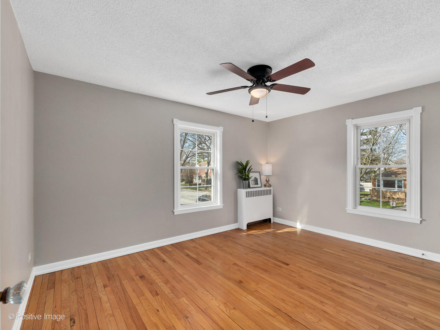 3505 Prairie Avenue, Unit 2W Brookfield, IL 60513 - Photo 9 of 11 a view of an empty room with a window and wooden floor