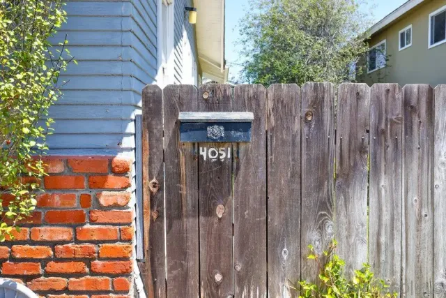 a view of a wooden door with a house