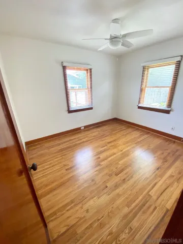 a bathroom with a toilet and a shower curtain