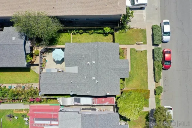 an aerial view of house with yard swimming pool and outdoor seating