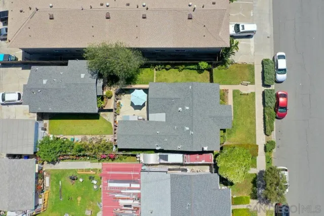 an aerial view of a house with a swimming pool
