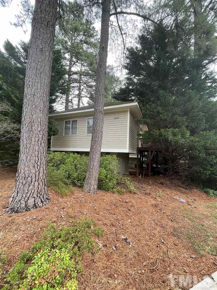 3287 Mill Run, Unit 147 Raleigh, NC 27612 - Photo 3 of 3 a view of a house with a tree in the yard