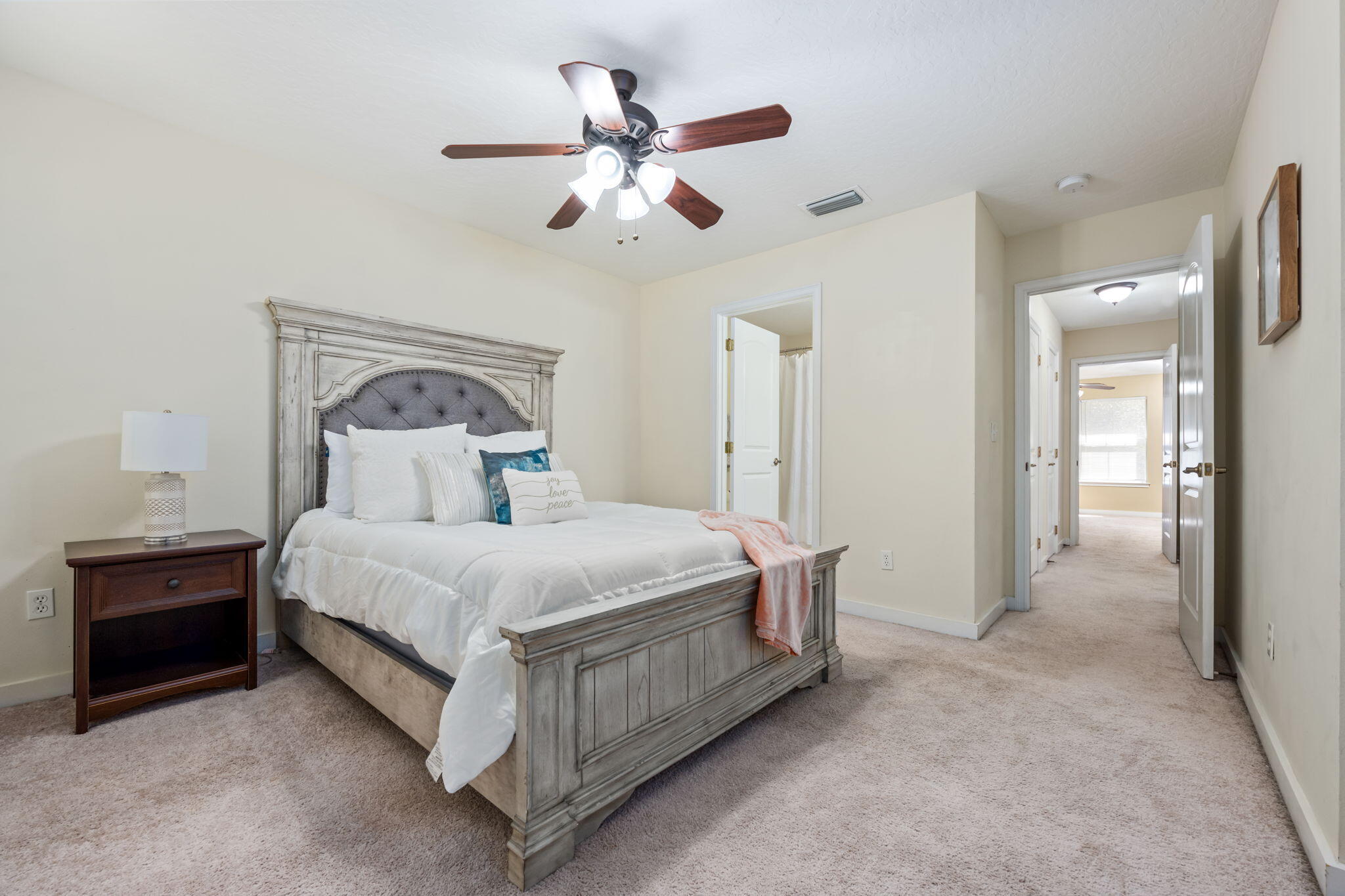 108 Hawkins Road, Unit E Fort Walton Beach, FL 32547 - Photo 17 of 41 a bedroom with a bed and a ceiling fan
