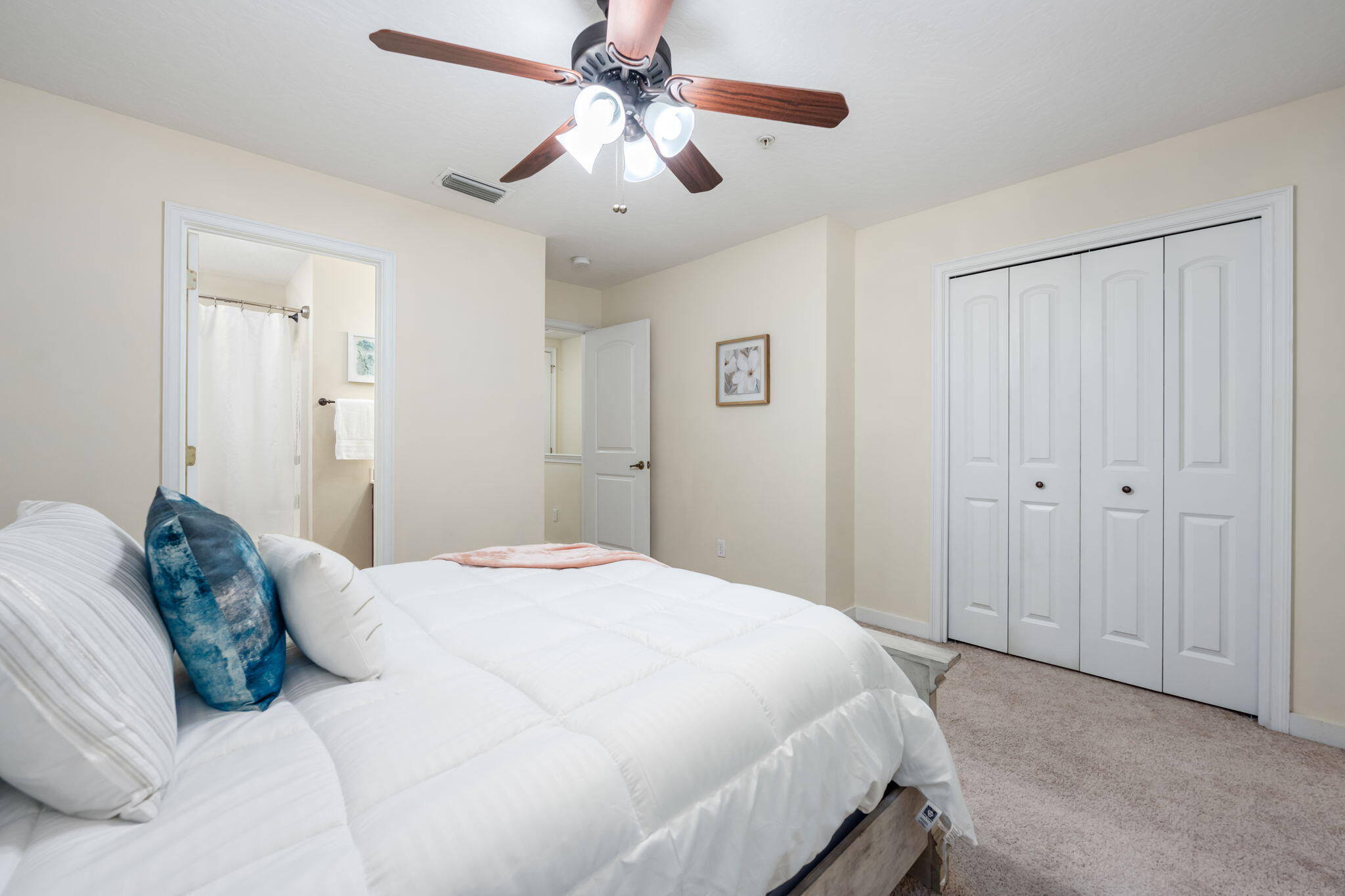 108 Hawkins Road, Unit E Fort Walton Beach, FL 32547 - Photo 18 of 41 a bed room with a bed and a ceiling fan