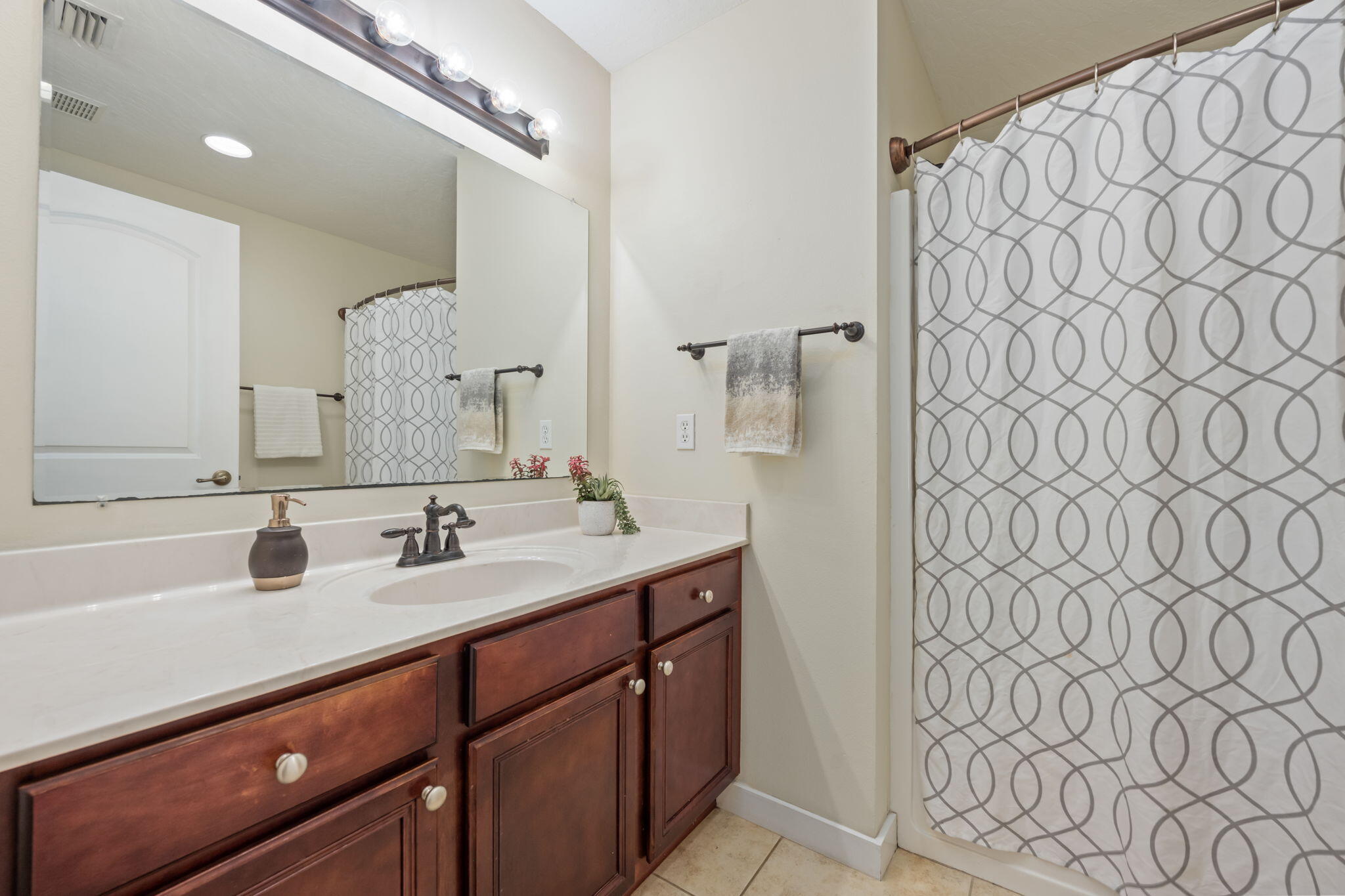 108 Hawkins Road, Unit E Fort Walton Beach, FL 32547 - Photo 27 of 41 a bathroom with a sink and a mirror