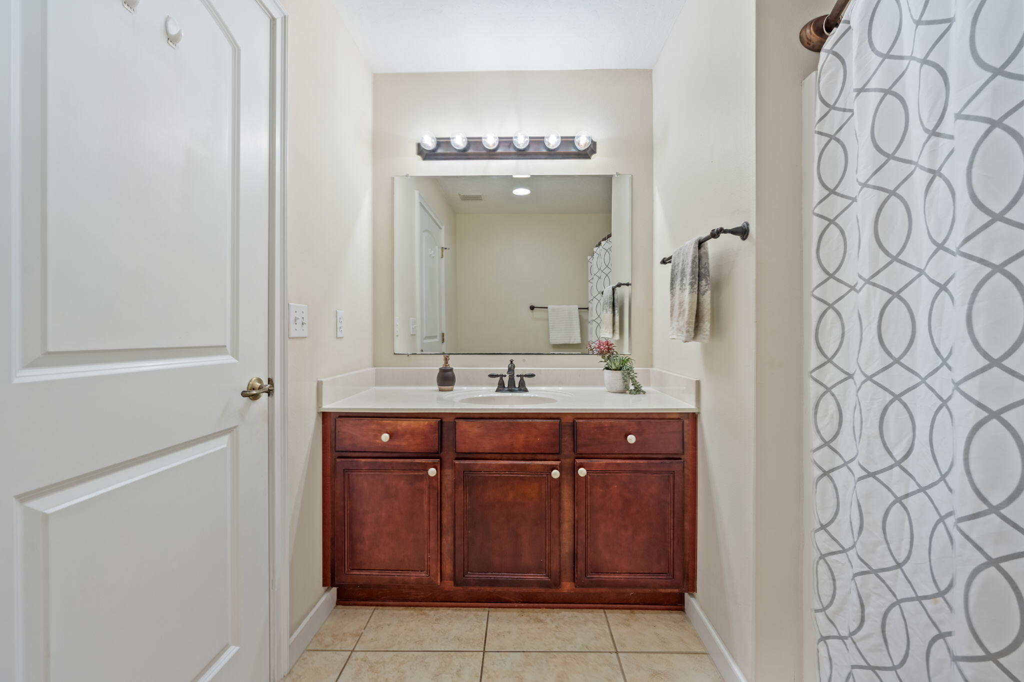 108 Hawkins Road, Unit E Fort Walton Beach, FL 32547 - Photo 28 of 41 a bathroom with a sink and a mirror