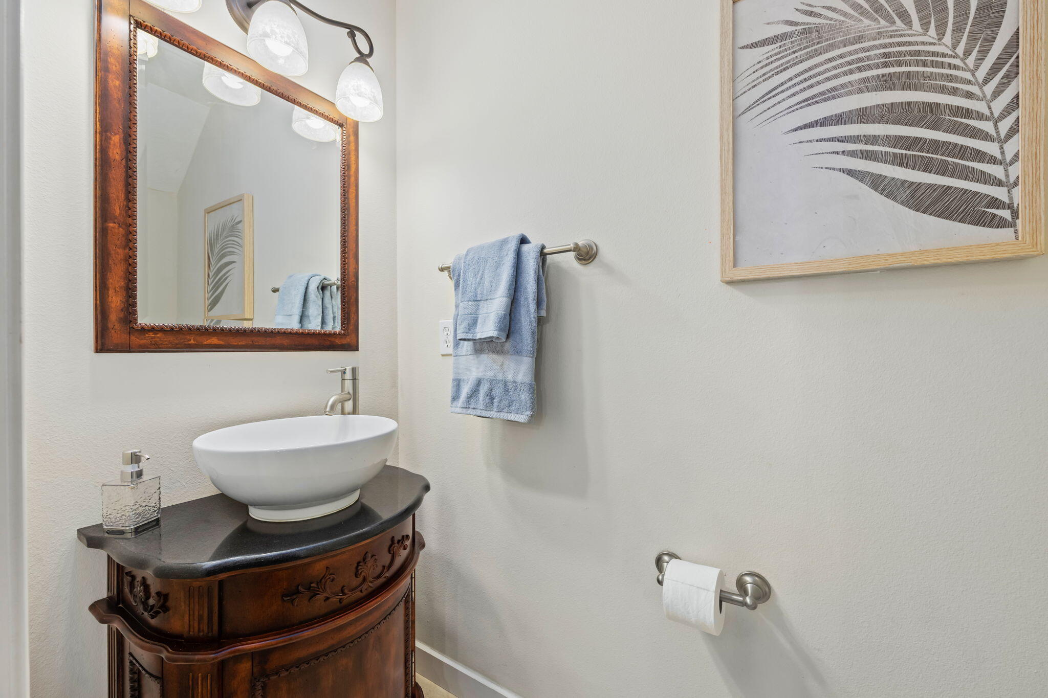 108 Hawkins Road, Unit E Fort Walton Beach, FL 32547 - Photo 30 of 41 a bathroom with a toilet a sink and mirror