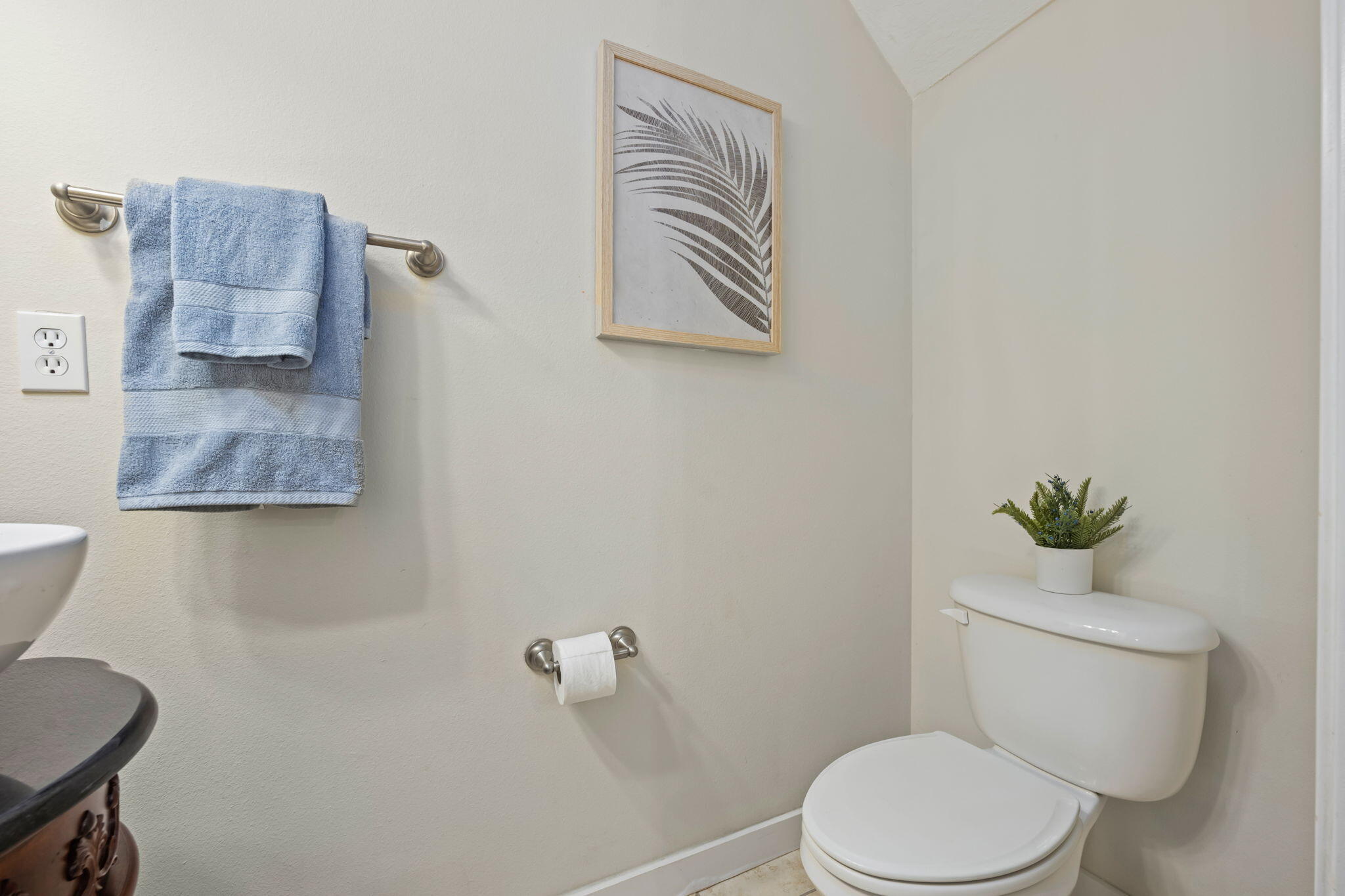 108 Hawkins Road, Unit E Fort Walton Beach, FL 32547 - Photo 31 of 41 a white toilet sitting next to a bathroom sink