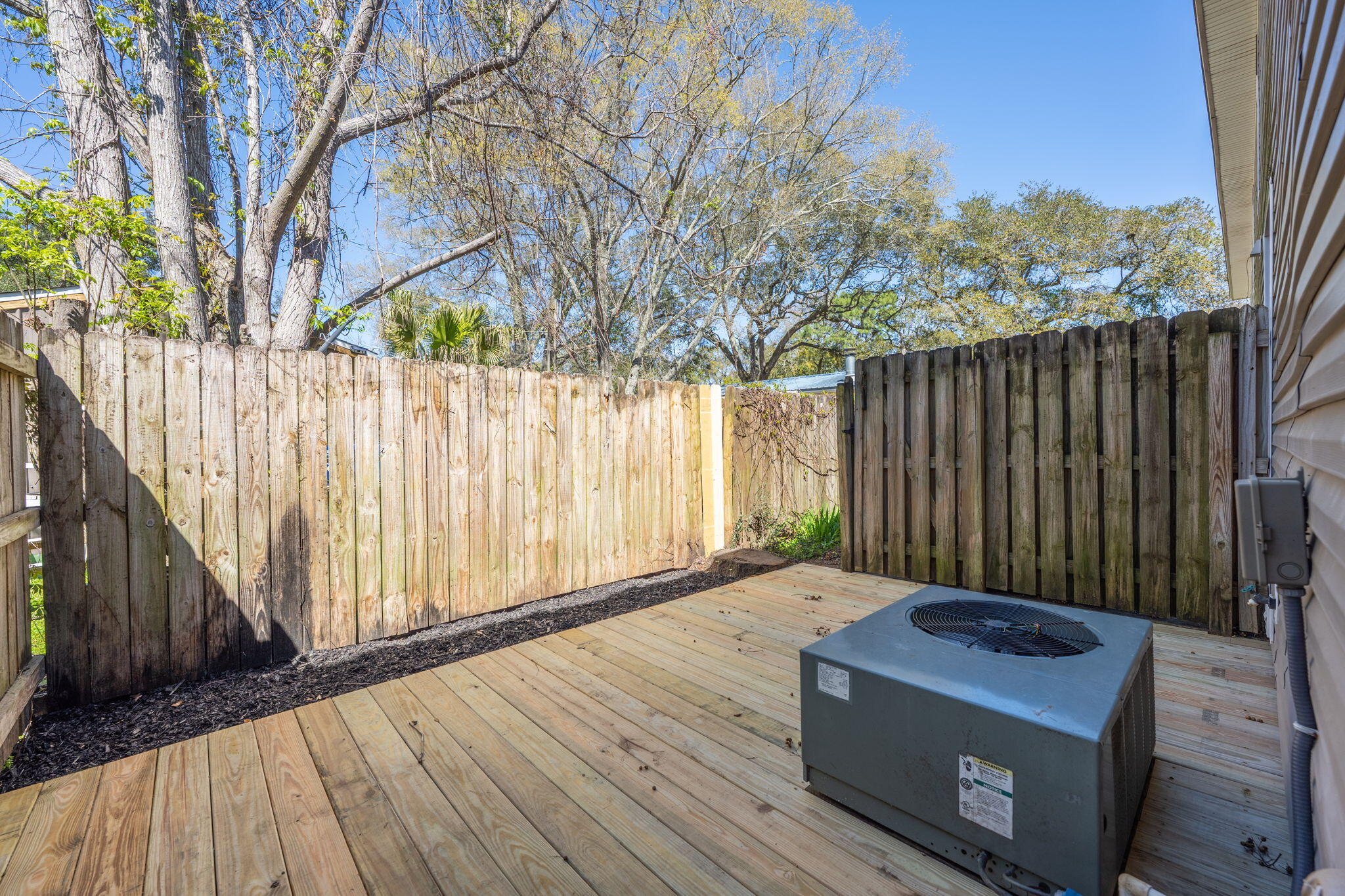 108 Hawkins Road, Unit E Fort Walton Beach, FL 32547 - Photo 32 of 41 a backyard of a house with wooden fence