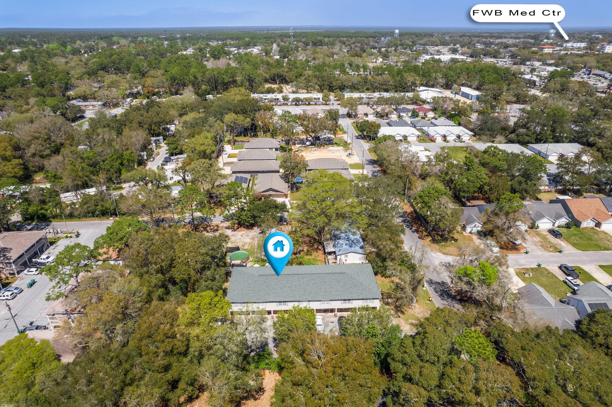 108 Hawkins Road, Unit E Fort Walton Beach, FL 32547 - Photo 38 of 41 an aerial view of residential houses with outdoor space