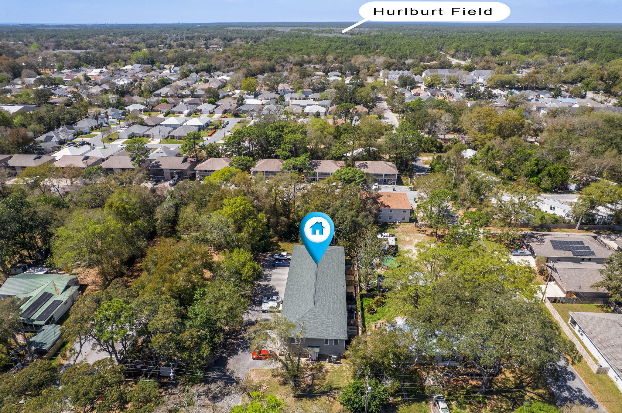 108 Hawkins Road, Unit E Fort Walton Beach, FL 32547 - Photo 40 of 41 an aerial view of a house with a yard and lake view