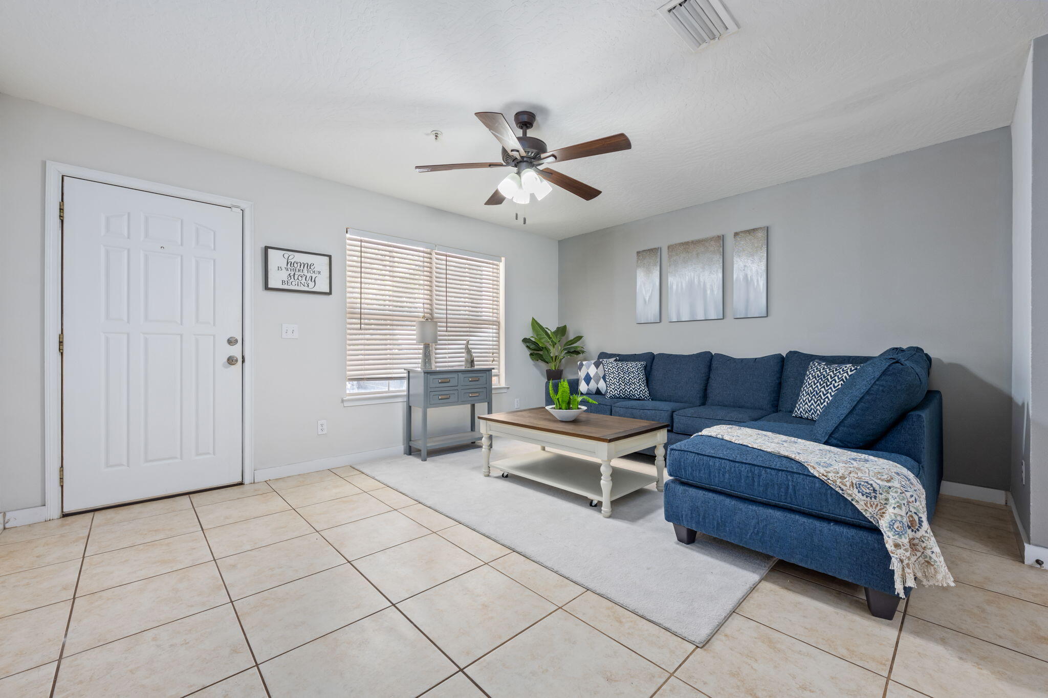 108 Hawkins Road, Unit E Fort Walton Beach, FL 32547 - Photo 6 of 41 a living room with furniture and a ceiling fan