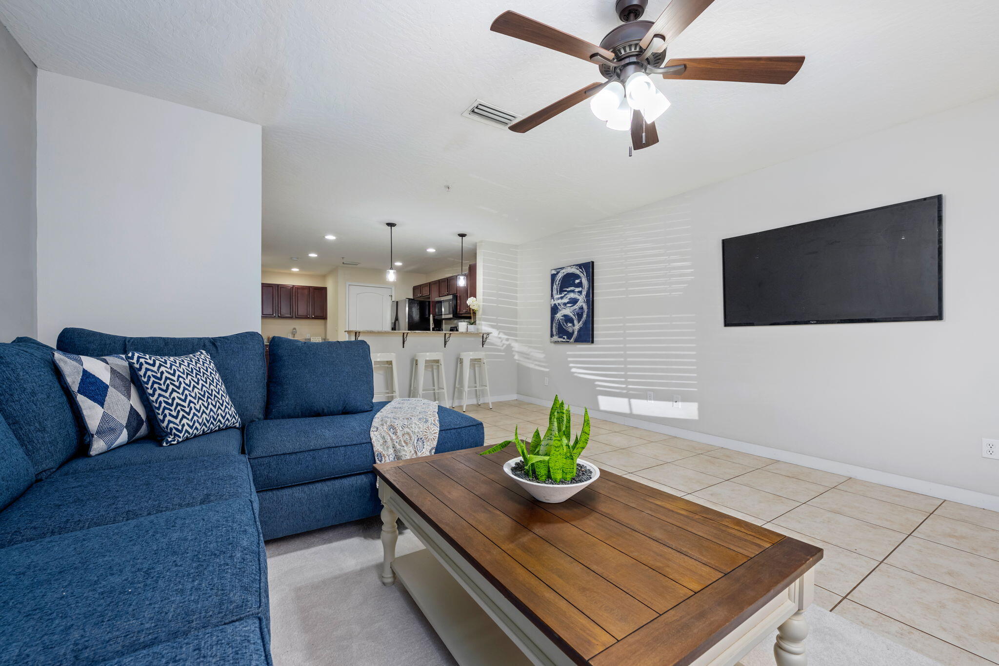 108 Hawkins Road, Unit E Fort Walton Beach, FL 32547 - Photo 7 of 41 a living room with furniture and a flat screen tv