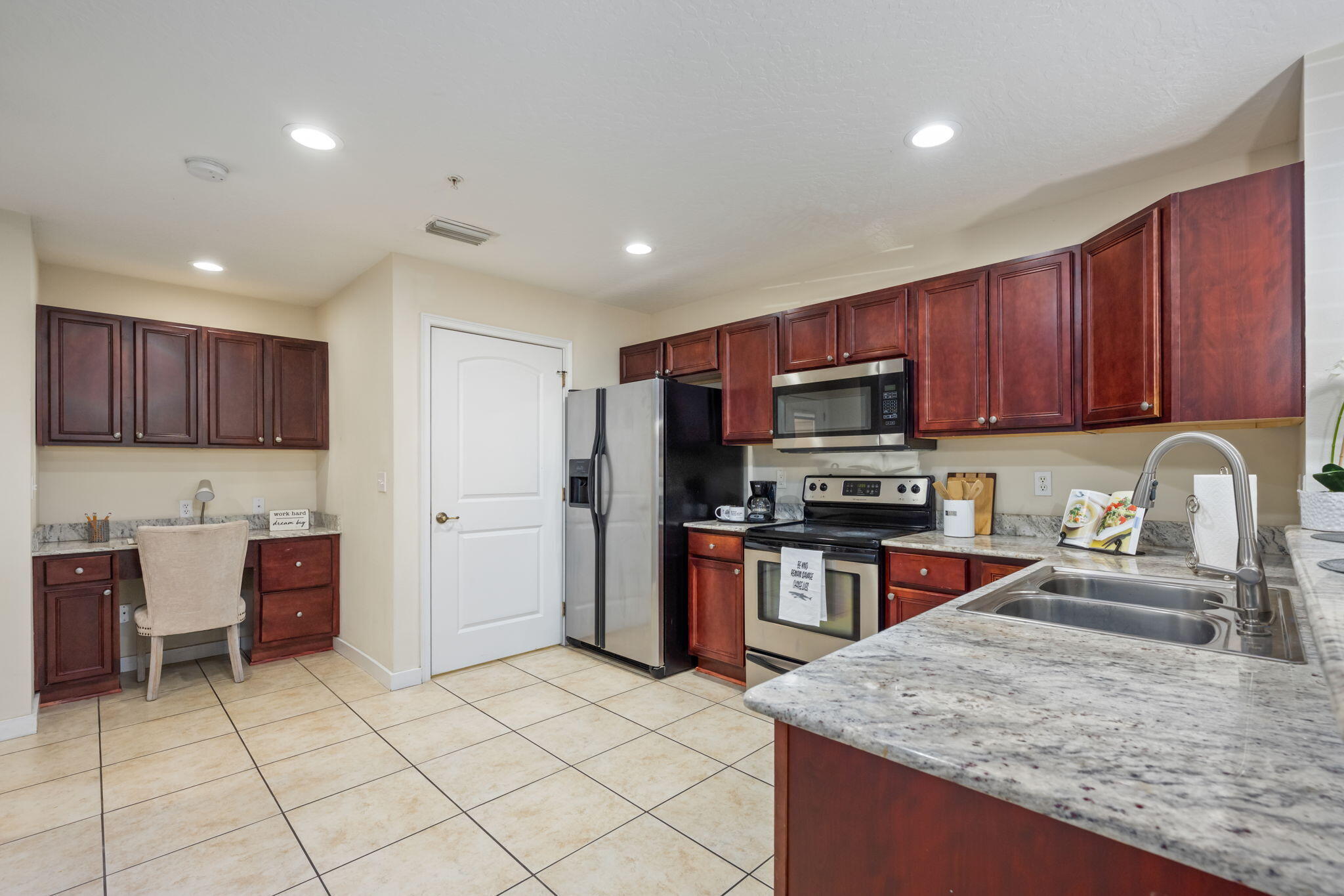 108 Hawkins Road, Unit E Fort Walton Beach, FL 32547 - Photo 10 of 41 a kitchen with stainless steel appliances granite countertop a sink stove and refrigerator