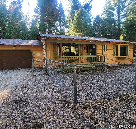10385 Ritts Mill Road Shingletown, CA 96088 - Photo 1 of 29 a front view of a house with garden