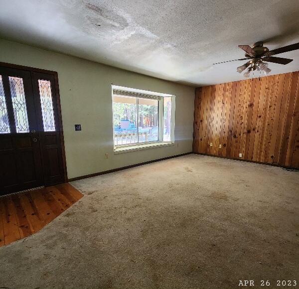 10385 Ritts Mill Road Shingletown, CA 96088 - Photo 11 of 29 an empty room with windows and fan