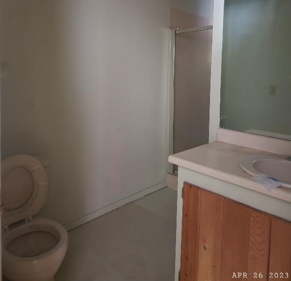 10385 Ritts Mill Road Shingletown, CA 96088 - Photo 14 of 29 a bathroom with a granite countertop toilet and a sink