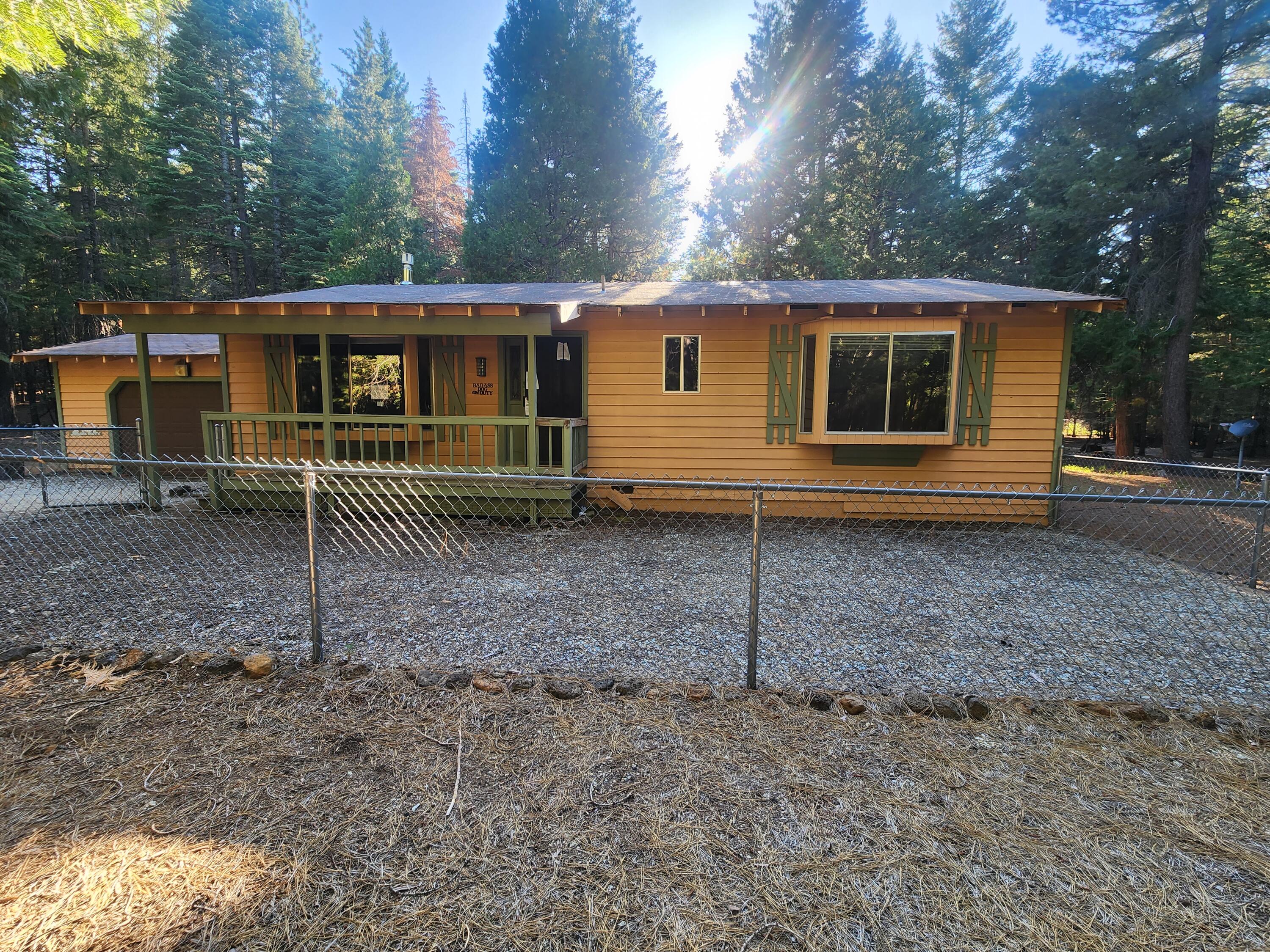 10385 Ritts Mill Road Shingletown, CA 96088 - Photo 2 of 29 a view of a house with a yard and large tree