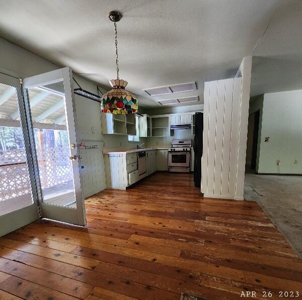 10385 Ritts Mill Road Shingletown, CA 96088 - Photo 25 of 29 a view of a kitchen with a refrigerator and microwave
