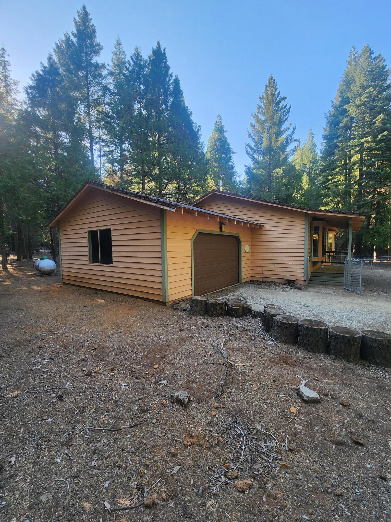 10385 Ritts Mill Road Shingletown, CA 96088 - Photo 3 of 29 a view of a house with a backyard