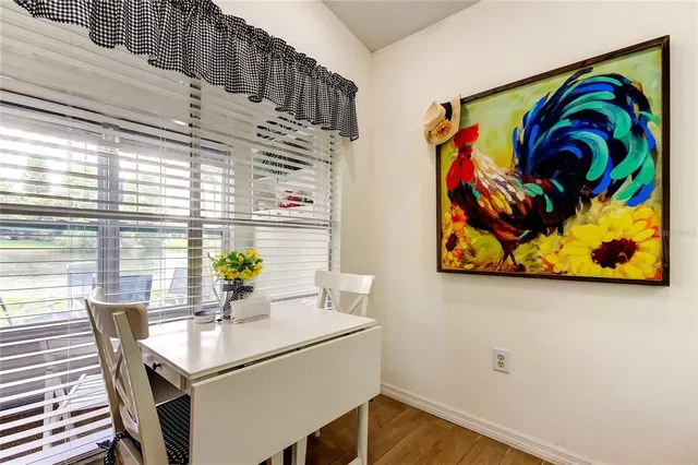 a view of a dining room with furniture and window