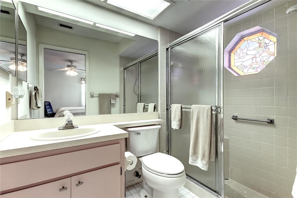 4756 Sheffield Drive New Port Richey, FL 34655 - Photo 19 of 30 a bathroom with a sink toilet and shower