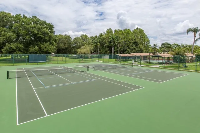 a view of an outdoor space and tennis court
