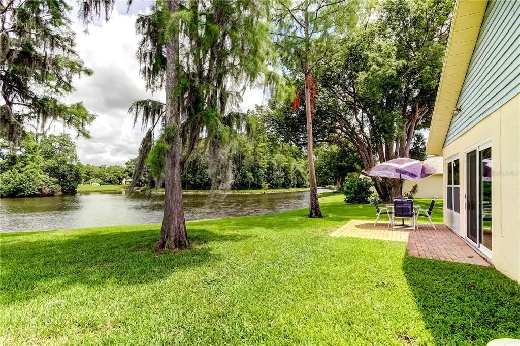 4756 Sheffield Drive New Port Richey, FL 34655 - Photo 4 of 30 a view of a fountain in front of a house with a fountain