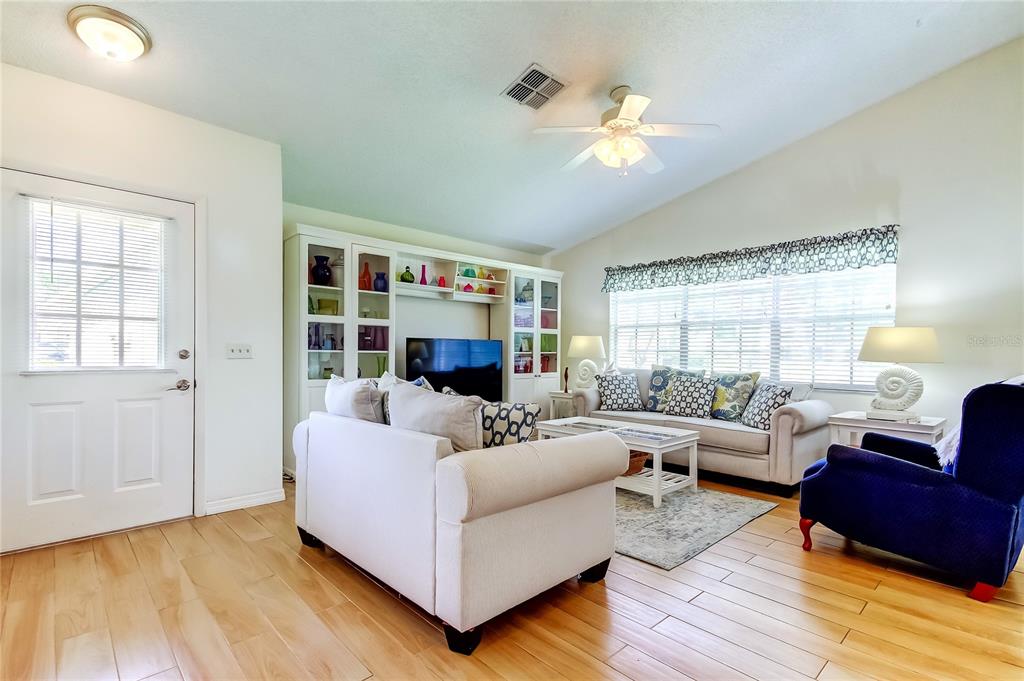 4756 Sheffield Drive New Port Richey, FL 34655 - Photo 9 of 30 a living room with furniture and a large window