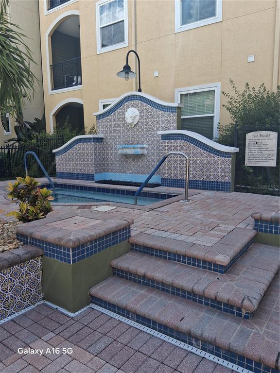 a view of a house with a wooden fence