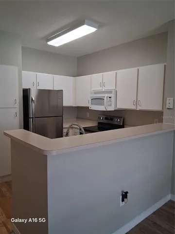 a refrigerator freezer sitting in a kitchen