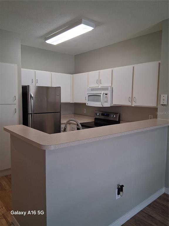 1810 East Palm Avenue, Unit 5220 Tampa, FL 33605 - Photo 12 of 17 a refrigerator freezer sitting in a kitchen
