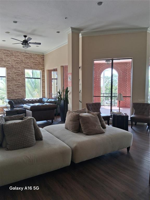 1810 East Palm Avenue, Unit 5220 Tampa, FL 33605 - Photo 15 of 17 a living room with furniture and a large window