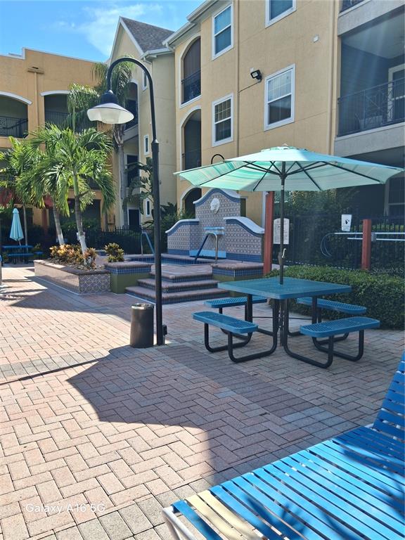 1810 East Palm Avenue, Unit 5220 Tampa, FL 33605 - Photo 2 of 17 a view of a building with sitting area