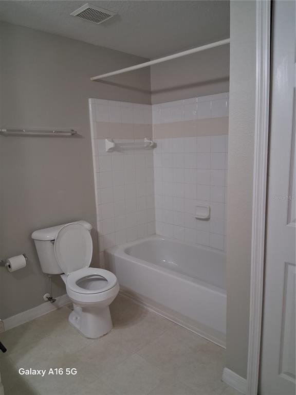 1810 East Palm Avenue, Unit 5220 Tampa, FL 33605 - Photo 9 of 17 a bathroom with a toilet and a shower